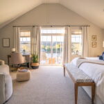 Primary bedroom with deck & lake/mountain view Primary bedroom with deck & lake/mountain view